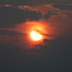 Wildfire smoke chokes the Sun over the Rockies.